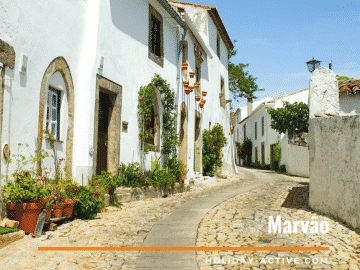 Flowers, white washed houses and winding streets give Marvão village in Portugal a special charm