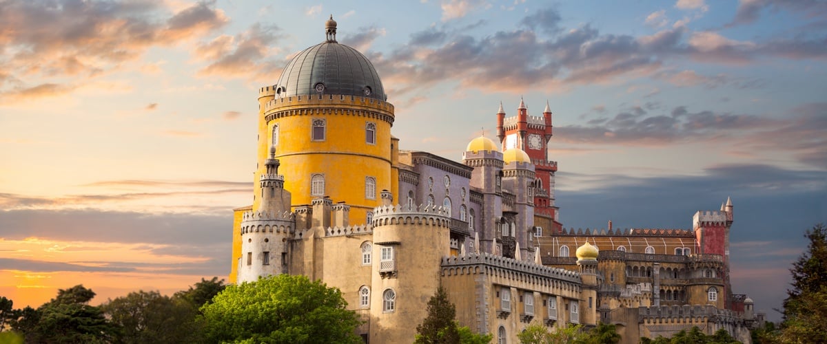 Fairy Palace against beautiful sky / Panorama of Pena Palace in Sintra, Portugal / Europe